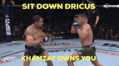 Two Men Are Fighting In A Ring With The Words Sit Down Drius Khamzat Owns You Above Them GIF