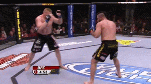 Two Men Are Fighting In A Ufc Ring With The Time 4:53 GIF