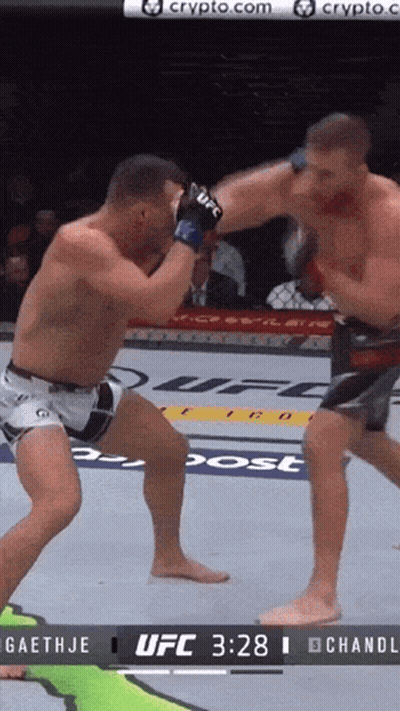 Two Men Are Fighting In A Ufc Ring GIF
