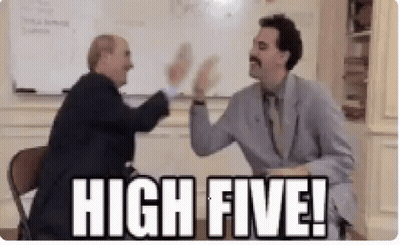 Two Men Are Giving Each Other A High Five In A Room . GIF