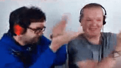 Two Men Are Giving Each Other A High Five While Wearing Headphones And Glasses . GIF