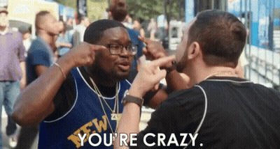 Two Men Are Having A Fight And One Of Them Is Pointing At The Other 'S Head . GIF