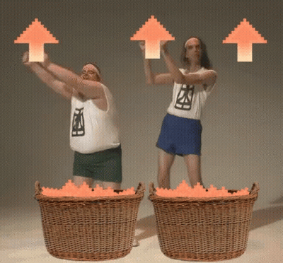 Two Men Are Holding Up Orange Arrows While Standing Next To Baskets GIF