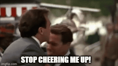 Two Men Are Kissing Each Other And The Words `` Stop Cheering Me Up '' Are Written On The Screen . GIF