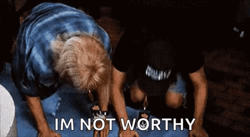 Two Men Are Kneeling Down And One Of Them Is Saying I 'M Not Worthy . GIF