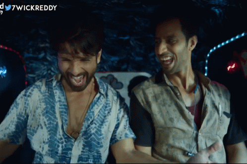 Two Men Are Laughing In A Dark Room And The Words Wickreddy Are On The Bottom GIF