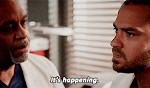 Two Men Are Looking At Each Other And One Of Them Says It 'S Happening GIF