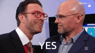 Two Men Are Looking At Each Other And The Word Yes Is On The Screen GIF