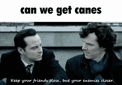 Two Men Are Looking At Each Other With The Words Can We Get Canes Below Them GIF