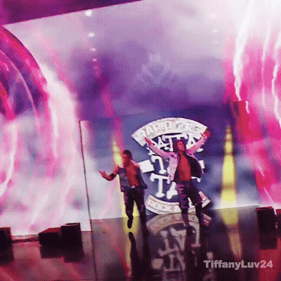 Two Men Are On A Stage In Front Of A Large Screen That Says Rapid Fire GIF