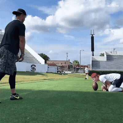 Two Men Are Playing A Game Of Football And One Of Them Is Wearing A Nike Shoe GIF