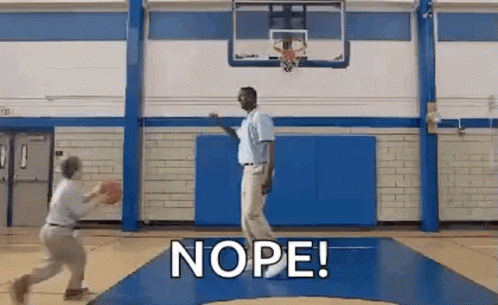 Two Men Are Playing Basketball In A Gym And One Of Them Is Holding A Basketball . GIF