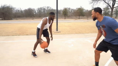 Two Men Are Playing Basketball On A Court And One Of Them Is Wearing A Shirt That Says Nike On It GIF