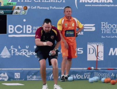 Two Men Are Playing Bowling In Front Of A Sign That Says Bcib GIF
