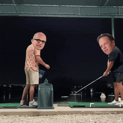 Two Men Are Playing Golf And One Has A Big Head On His Head GIF