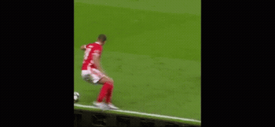 Two Men Are Playing Soccer On A Field And One Of Them Is Wearing A Number 21 Jersey . GIF