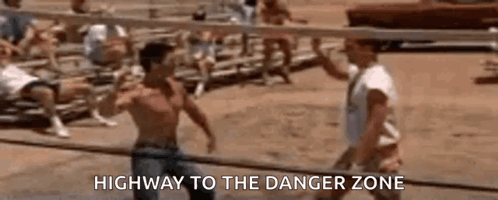 Two Men Are Playing Volleyball On A Beach And One Of Them Is Talking To The Other . GIF