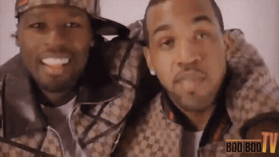 Two Men Are Posing For A Picture With The Words Boo Boo Tv In The Background GIF