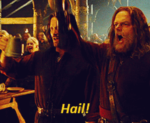 Two Men Are Raising Their Arms In The Air And One Of Them Is Saying " Hail " GIF