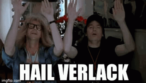 Two Men Are Raising Their Hands In The Air With The Words `` Hail Verlack '' Written Below Them . GIF