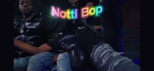 Two Men Are Riding A Roller Coaster And The Words " Notti Bop " Are Glowing In The Background GIF