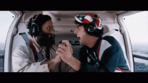 Two Men Shaking Hands In Helicopter GIF