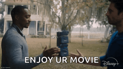 Two Men Are Shaking Hands In Front Of A House And The Words `` Enjoy Ur Movie '' Are Written On The Bottom . GIF