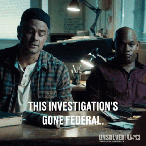 Two Men Are Sitting At A Desk With A Caption That Says This Investigation 'S Gone Federal GIF