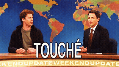 Two Men Are Sitting At A Desk With A Sign That Says " Touche " GIF