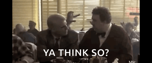 Two Men Are Sitting At A Table In A Diner Talking To Each Other And The Words `` Ya Think So '' Are Visible . GIF
