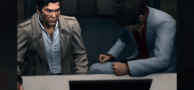 Two Men Are Sitting At A Table Looking At A Computer Screen . GIF