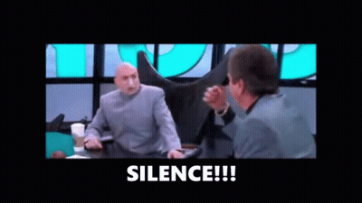 Two Men Are Sitting At A Table Talking To Each Other And The Words `` Silence '' Are Visible In The Corner . GIF