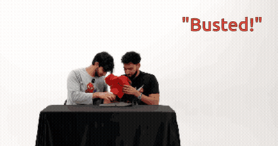 Two Men Are Sitting At A Table With The Words " Busted " On The Bottom GIF