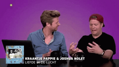 Two Men Are Sitting At A Table With The Words Kraantje Pappie & Joshua Nolet Liefde In De Lucht GIF