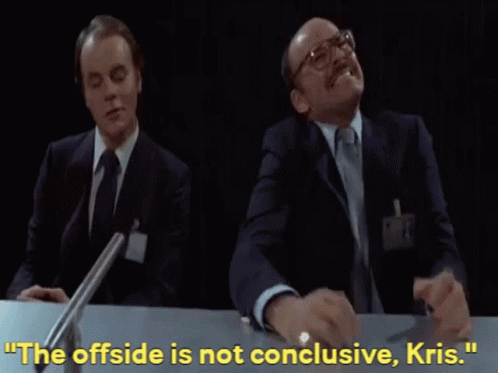 Two Men Are Sitting At A Table With The Words " The Offside Is Not Conclusive Kris " Written Above Them GIF