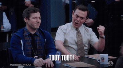 Two Men Are Sitting At A Table With The Words Toot Toot Written On The Table GIF