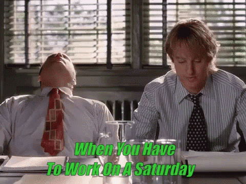 Two Men Are Sitting At A Table With The Words " When You Have To Work On A Saturday " On The Bottom GIF