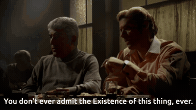 Two Men Are Sitting At A Table With The Words You Don T Ever Admit The Existence Of This Thing Ever GIF