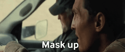 Two Men Are Sitting In A Car And One Of Them Is Saying Mask Up . GIF