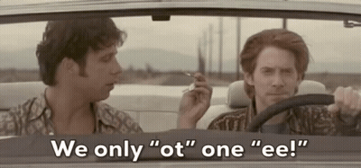 Two Men Are Sitting In A Car And One Of Them Is Smoking A Cigarette . GIF
