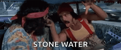 Two Men Are Sitting In A Car Talking To Each Other And The Words Stone Water Are Visible On The Screen . GIF
