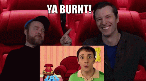 Two Men Are Sitting In A Movie Theater Watching A Blue's Clues Show GIF