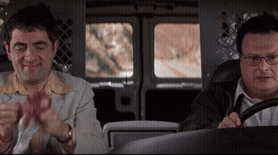 Two Men Are Sitting In A Van And One Has Glasses GIF