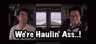 Two Men Are Sitting In A Van And One Of Them Is Saying We 'Re Haulin ' Ass ! GIF