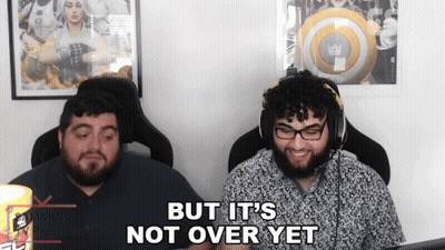 Two Men Are Sitting In Front Of A Computer With The Words But It 'S Not Over Yet GIF