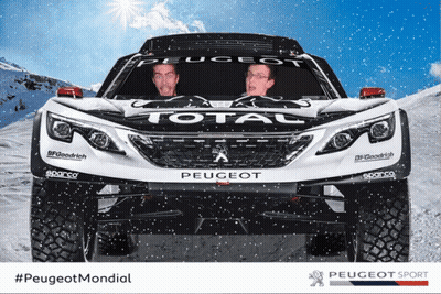 Two Men Are Sitting In Front Of A Peugeot Total Vehicle GIF