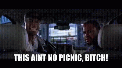 Two Men Are Sitting In The Back Seat Of A Car And Talking . GIF