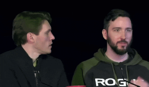 Two Men Are Sitting Next To Each Other And One Has A Hoodie That Says Rog On It GIF