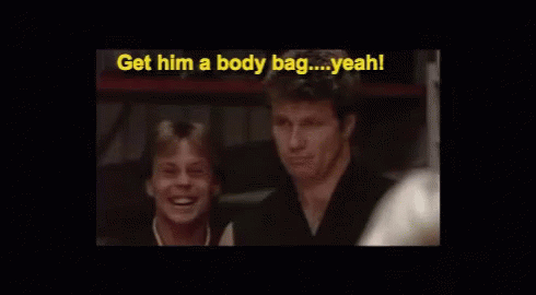 Two Men Are Sitting Next To Each Other And One Of Them Is Saying Get Him A Body Bag Yeah ! GIF