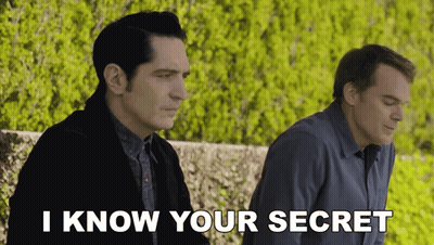 Two Men Are Sitting Next To Each Other And One Of Them Is Saying I Know Your Secret GIF